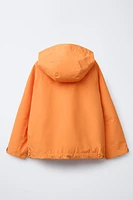 VESTE LÉGÈRE À CAPUCHE DÉPERLANTE