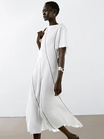 Flowing linen blend dress with contrasting details