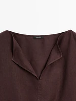 Linen blouse with elasticated hem