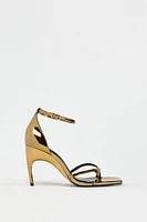 OVAL HEELED METALLIC SANDALS