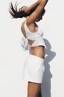 EMBROIDERED EYELET CORSET TOP