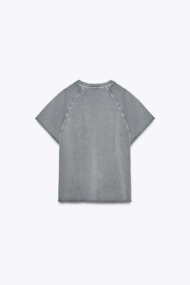 SWEAT EN MOLLETON À EFFET DÉLAVÉ ET INSCRIPTION