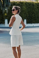 TOP GILET EN MAILLE PÉPLUM