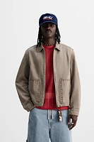 VESTE DÉLAVÉE CLOUS