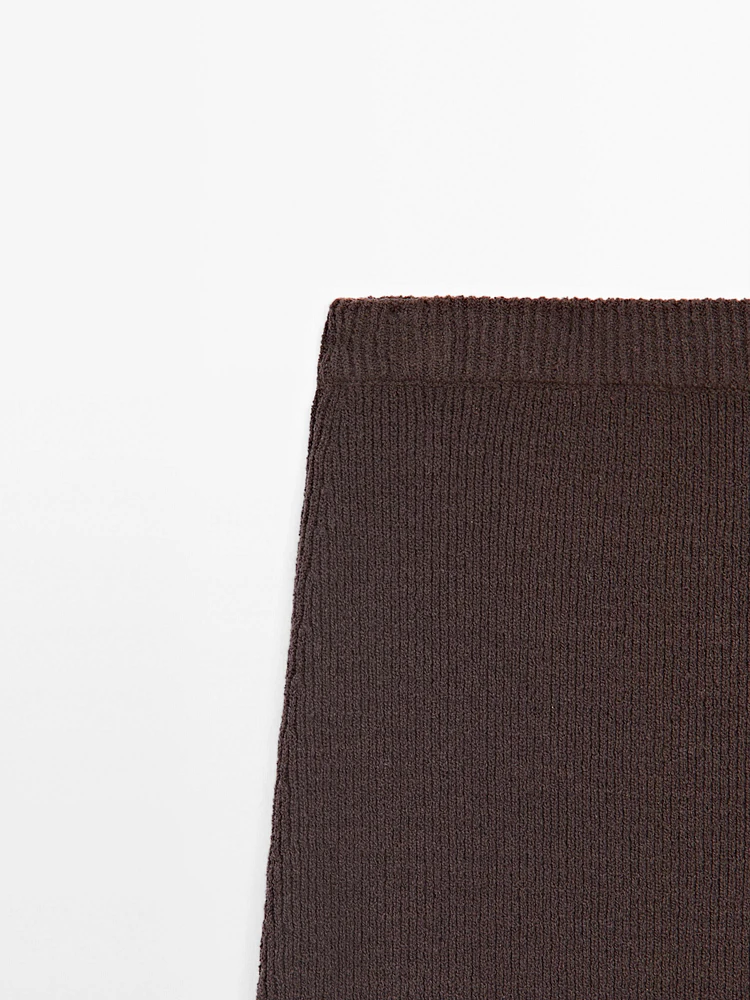 Long knit skirt with fringed hem