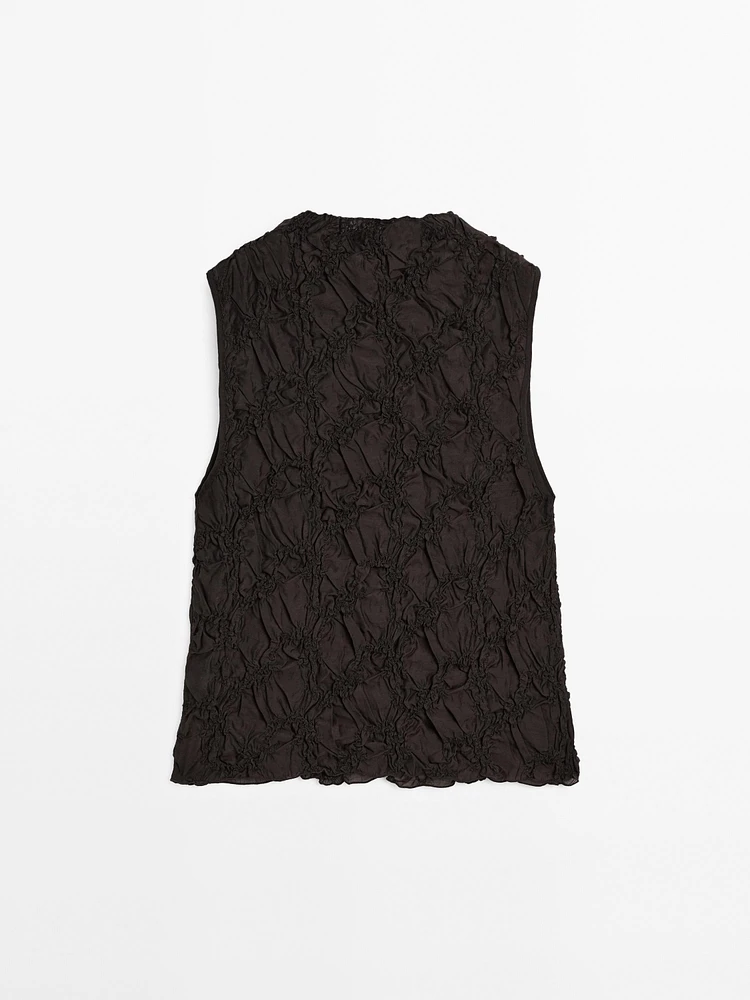 Creased-effect funnel neck top