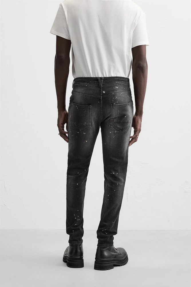 SPLATTERED RIPPED SKINNY JEANS