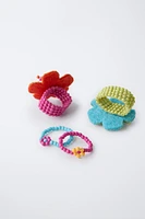 LOT DE QUATRE BAGUES FLEURS FANTAISIE