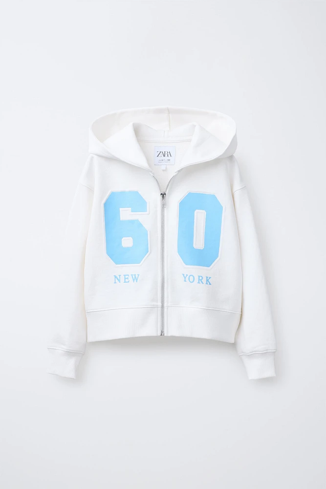 SWEAT COURT À CAPUCHE ZIP VARSITY