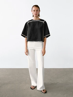 Blouse avec broderie contrastante