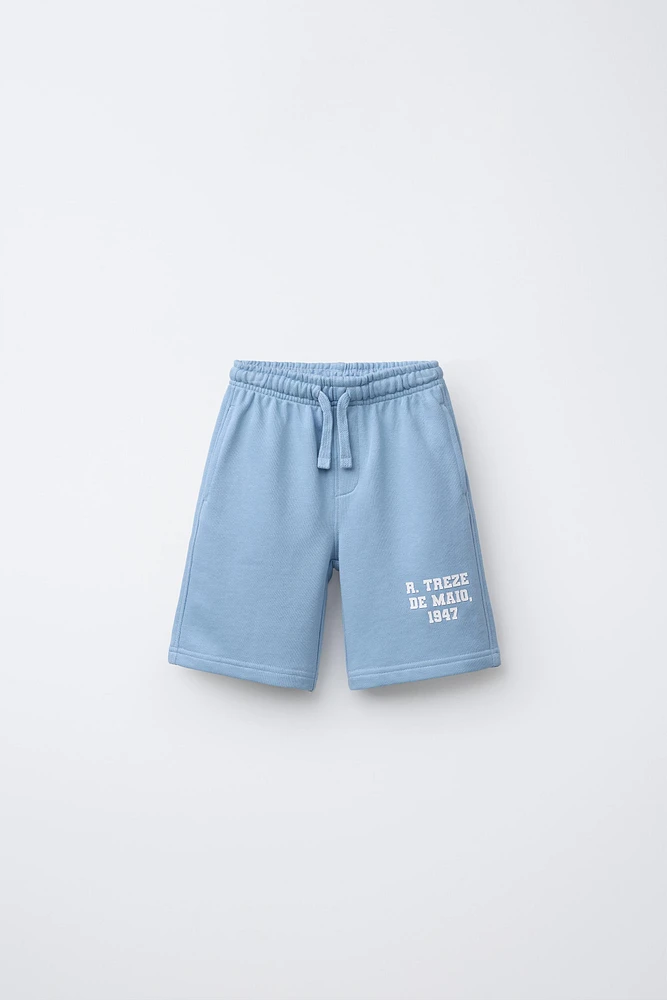 RAISED TEXT PLUSH SHORTS