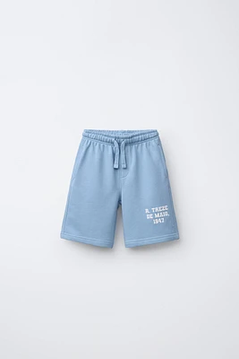 RAISED TEXT PLUSH SHORTS