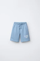 RAISED TEXT PLUSH SHORTS