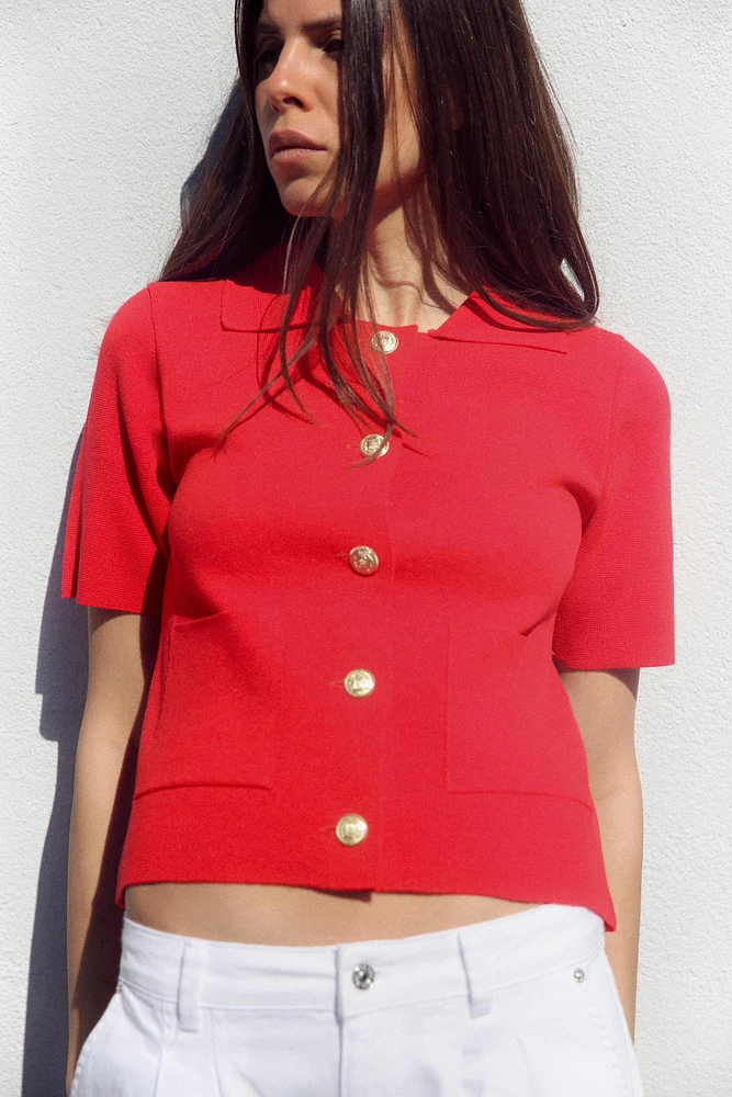 GILET EN MAILLE À MANCHES COURTES