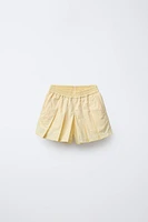 JUPE-SHORT TECHNIQUE À PLIS PLATS