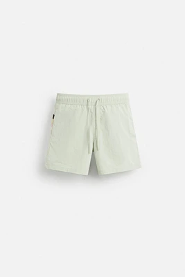 CONTRAST BANDS MID-LENGTH SWIMSUIT