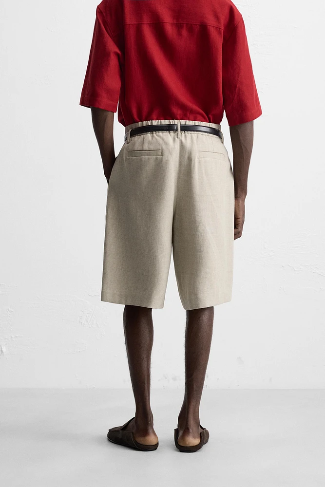 PLEATED WIDE FIT BERMUDA SHORTS
