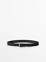 Leather belt with metallic buckle