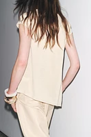 ASYMMETRIC HEM KNIT TOP