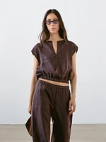 Linen blouse with elasticated hem