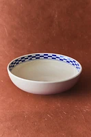 CERAMIC BOWL WITH A CHECKED DESIGN ON THE RIM