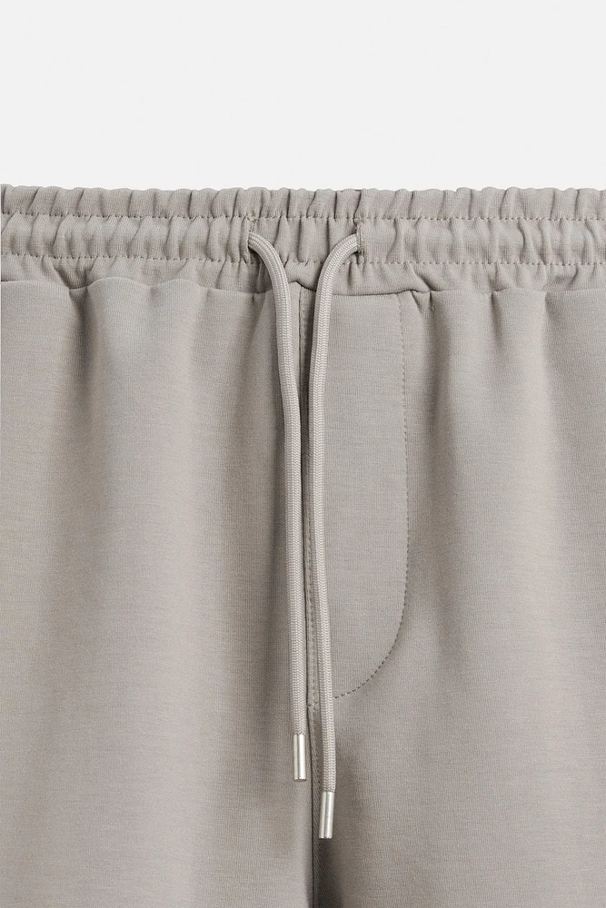 BERMUDA DE JOGGING OVERSIZE TECHNIQUE