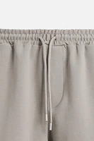 BERMUDA DE JOGGING OVERSIZE TECHNIQUE