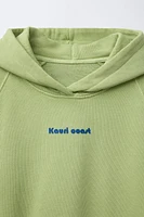 ENSEMBLE SWEAT À CAPUCHE ET BERMUDA AVEC INSCRIPTION