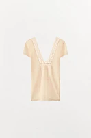 TOP EN MAILLE DENTELLE FLEUR