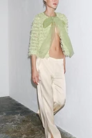 GILET EN MAILLE À FRANGES AVEC LACET ORGANZA