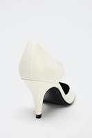 ASYMMETRIC LEATHER HEELS