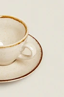 PORCELAIN TEACUP WITH ANTIQUE FINISH RIM