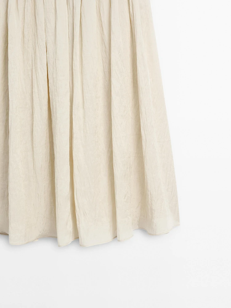 Flowing midi skirt with box pleats