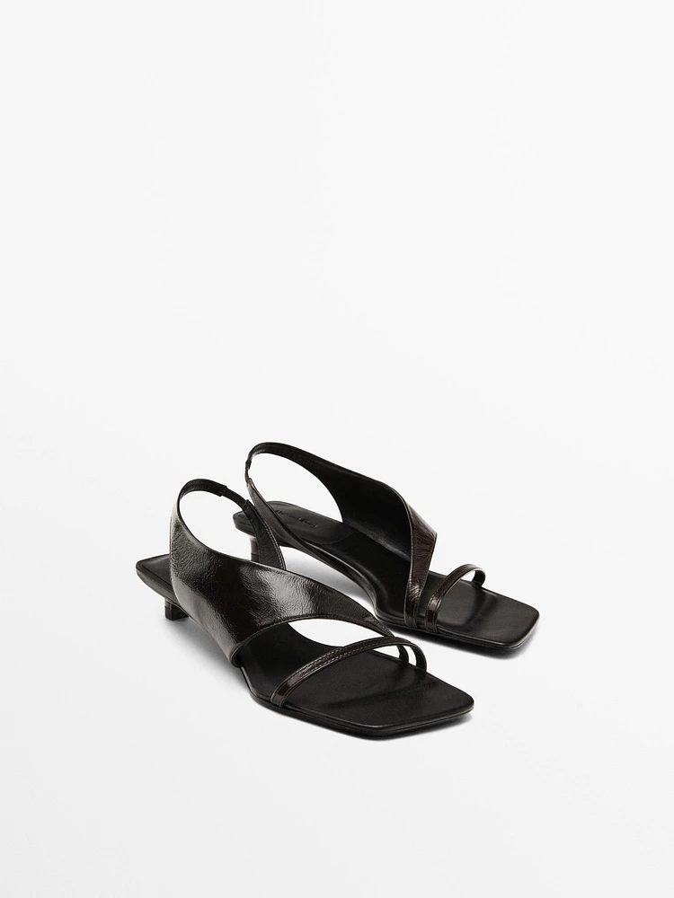 Asymmetric heeled sandals