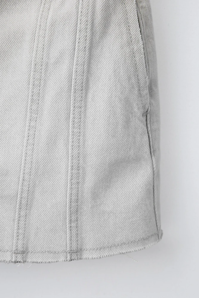 JUPE EN DENIM À COUPES EFFILOCHÉES