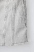 JUPE EN DENIM À COUPES EFFILOCHÉES