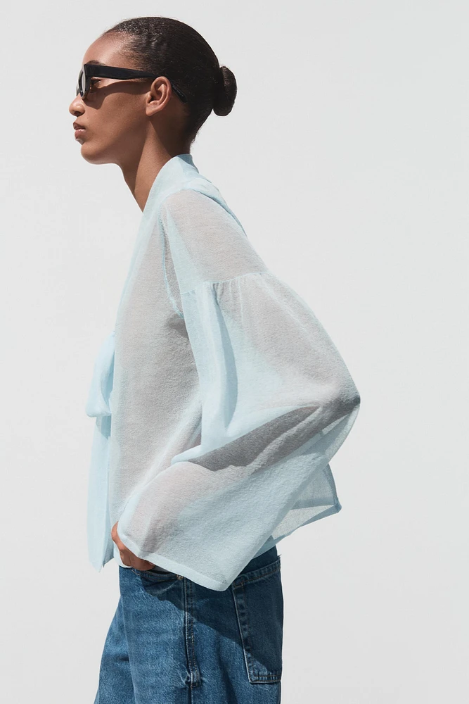 BLOUSE SEMI-TRANSPARENTE EN MAILLE