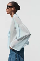 BLOUSE SEMI-TRANSPARENTE EN MAILLE