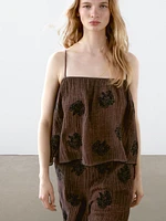 Flowing textured top with embroidered detail