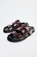 FLAT SANDALS WITH LEATHER STRAPS