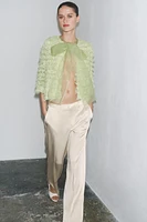 GILET EN MAILLE À FRANGES AVEC LACET ORGANZA