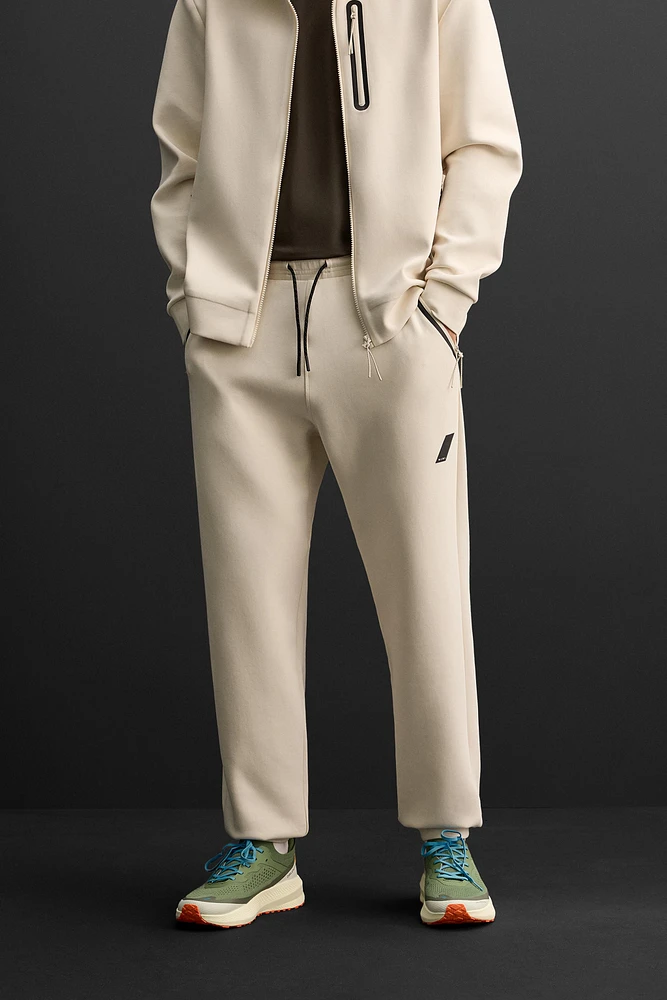 TECHNICAL ZIPPER JOGGER PANTS