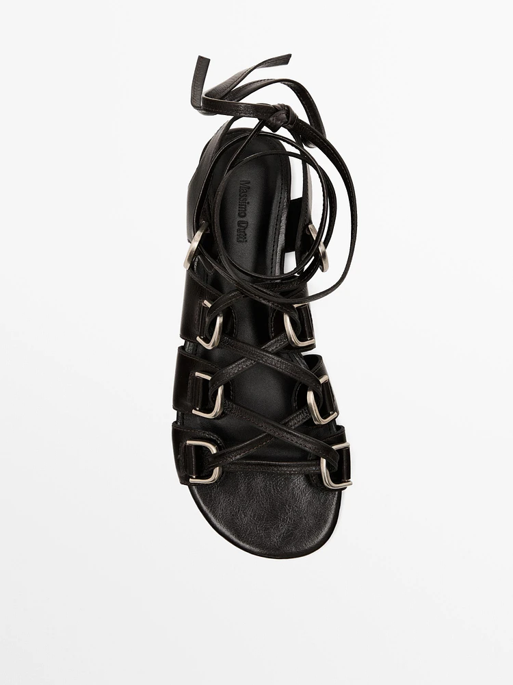 Lace-up sandals with rings
