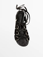 Lace-up sandals with rings