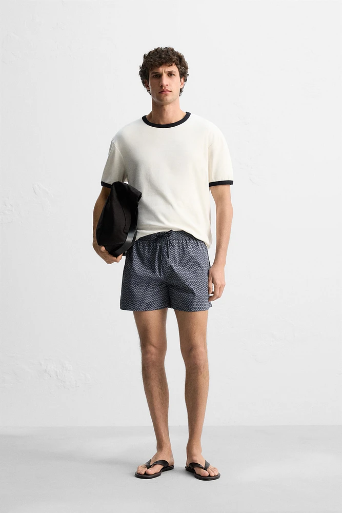 GEOMETRIC PRINT SHORT SWIMMING TRUNKS