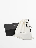 Sandales entre-doigts en cuir