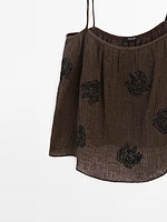Flowing textured top with embroidered detail