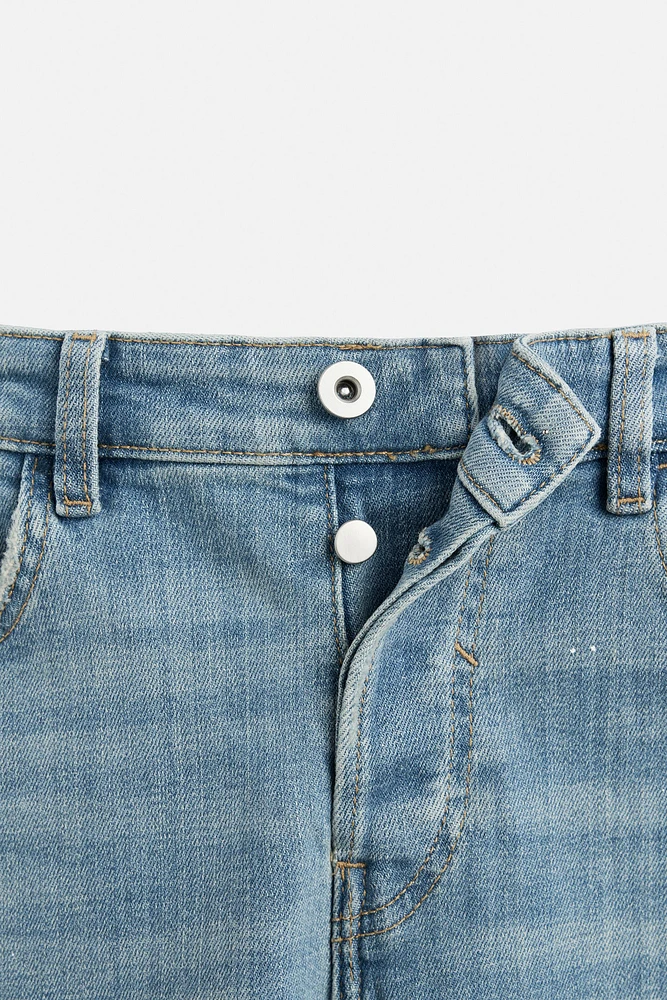 JEANS SKINNY AVEC DÉCHIRURES ET ÉCLABOUSSURES