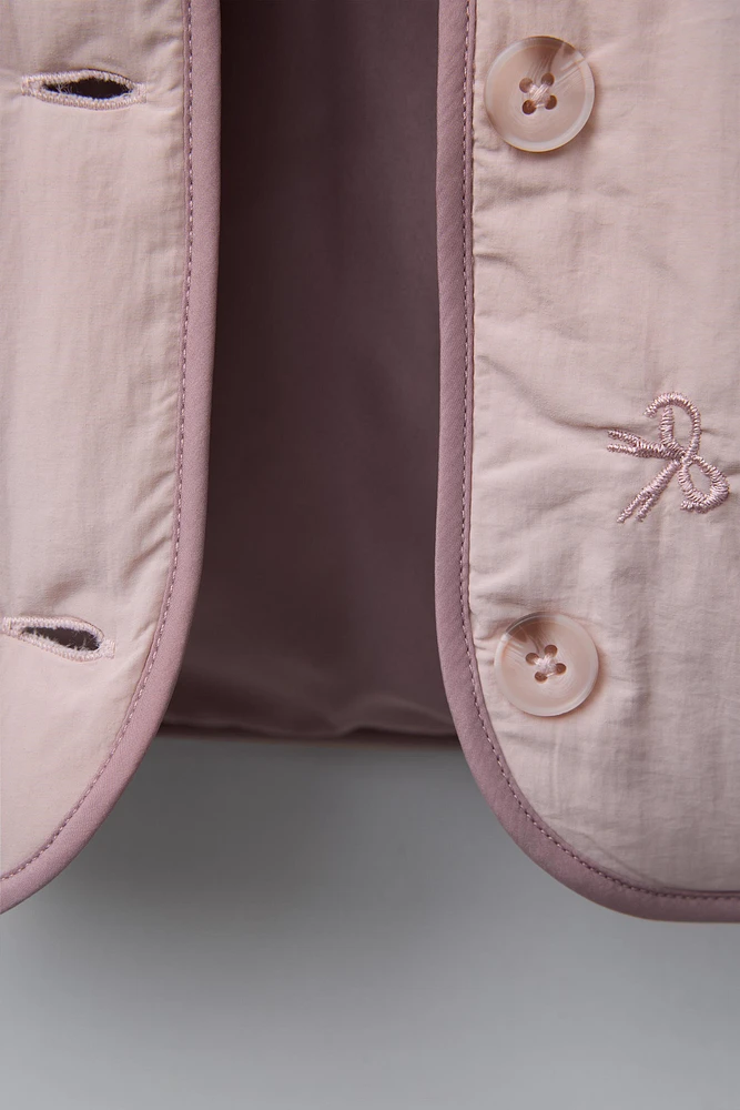 WATER REPELLENT PADDED JACKET WITH EMBROIDERED BOWS