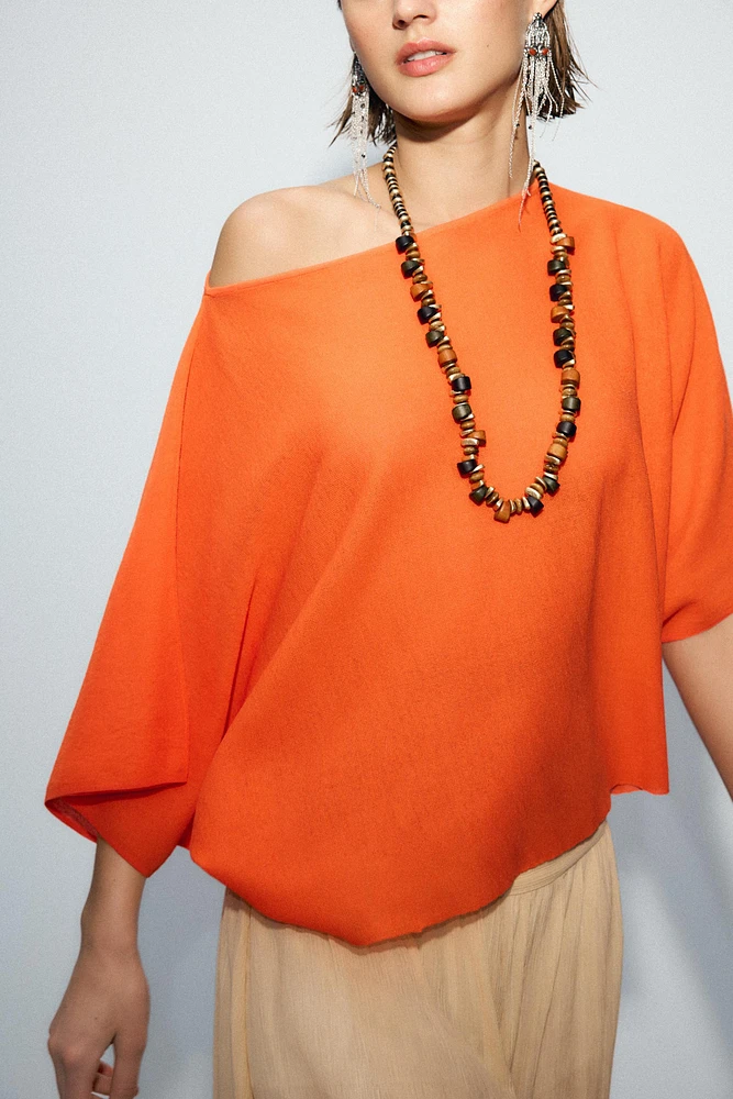 TOP CAPE EN MAILLE UNIE